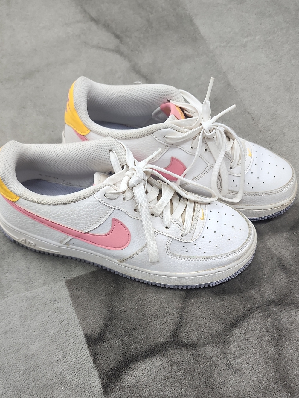 Nike Kids White Sneakers with Pink Swoosh and Yellow Heel Accent